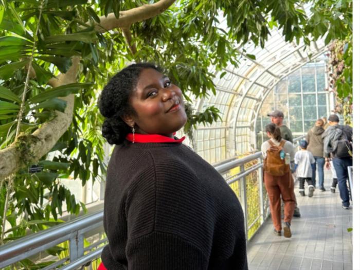 Kayla Gilbert in a conservatory.
