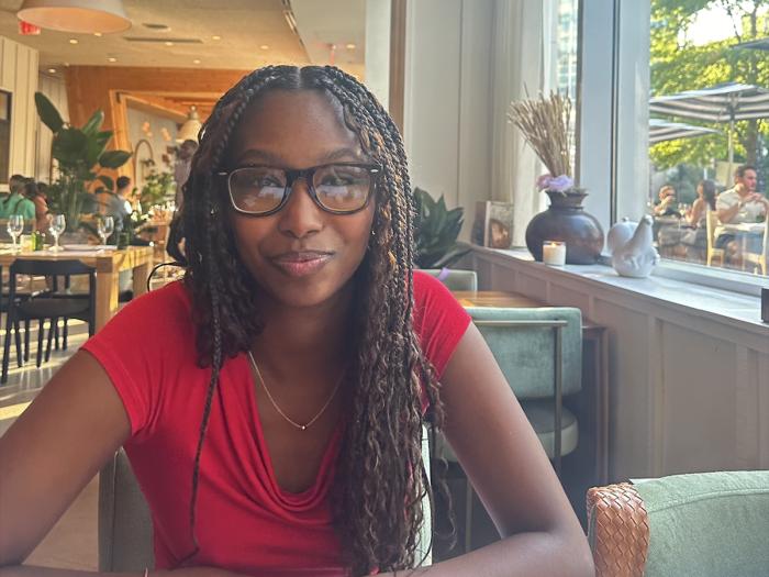 Soliana Mulugeta sitting in a restaurant.
