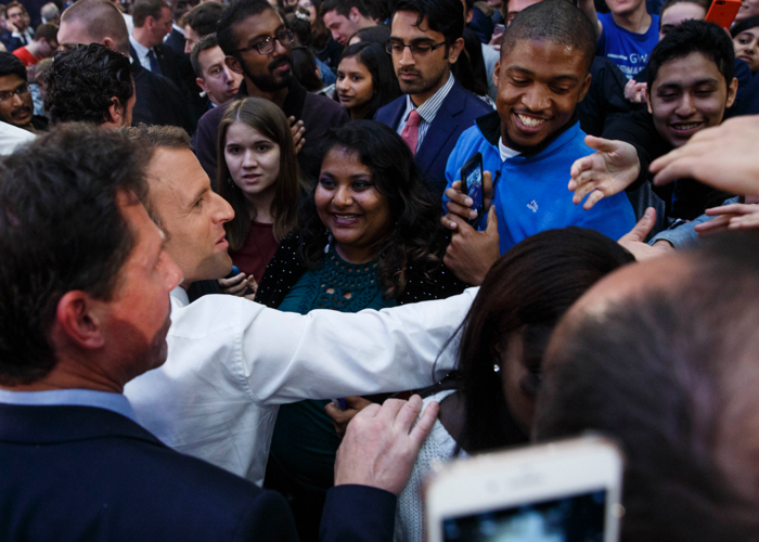 Emmanuel Macron greets a crowd